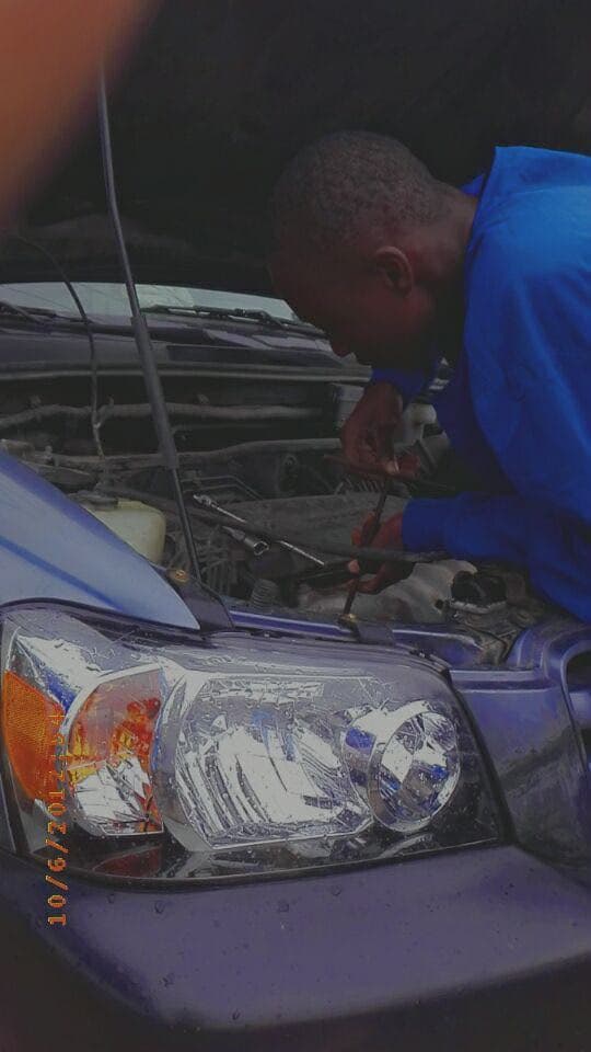 Olatunji rewiring and troubleshooting a vehicle by hand