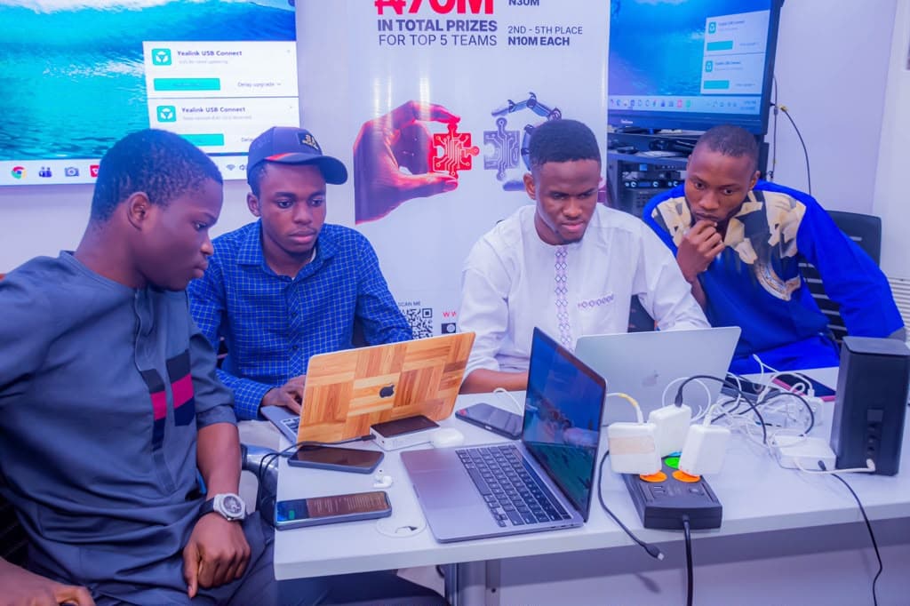 The team at their laptops during the hackathon