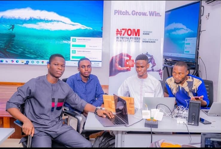 The team building at their laptops during the Zenith hackathon